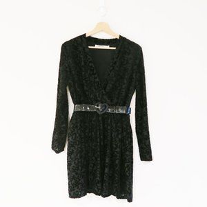Black mini dress crafted of velvet features a V-neck. Great condition